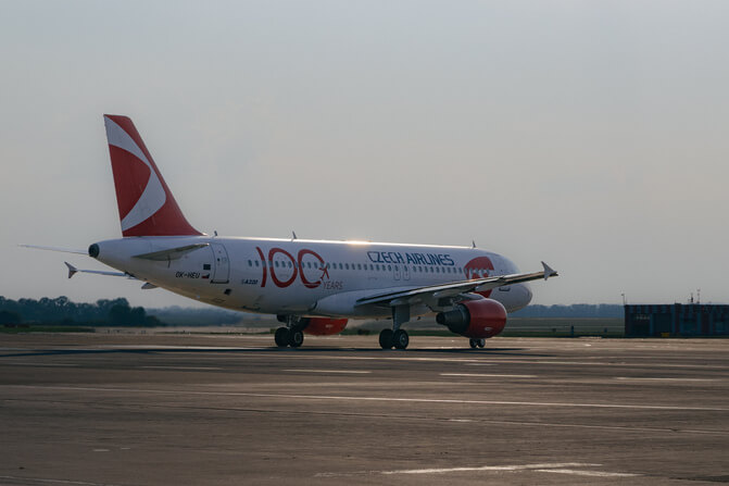 csa a320 at lkpr during sunset