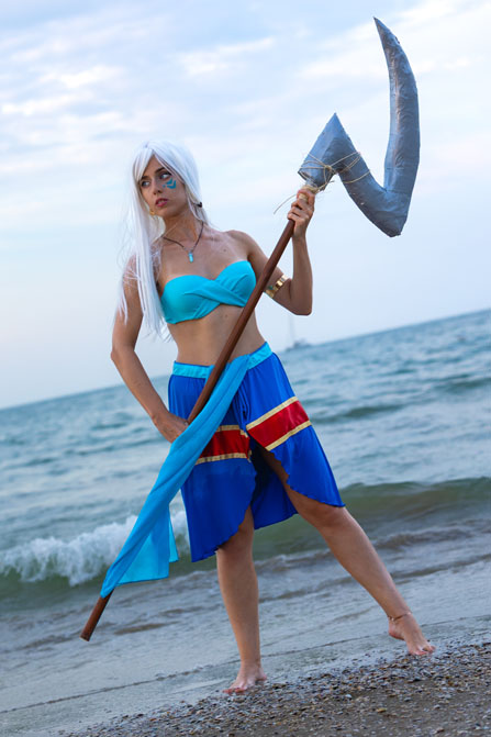 kida with weapon on a beach